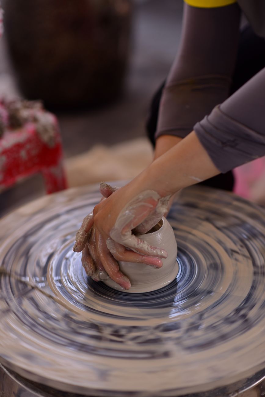 Potter Hands Throwing Clay Wheel